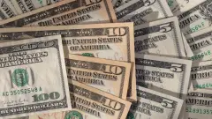 Курс доллара снизился к тенге на бирже 14 июля