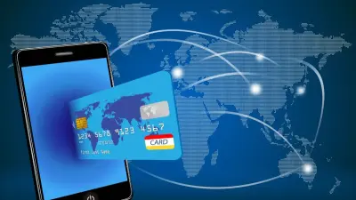 Почему при оплате картой за границей банк блокирует больше денег, чем списывает позже