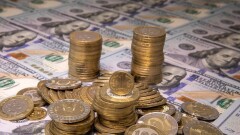 Тенге укрепился к доллару на торгах KASE
