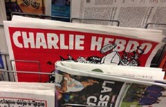 Злобного бога с автоматом изобразили на обложке Charlie Hebdo