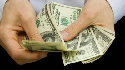 Курс доллара на бирже опустился до 411,5 тенге перед выходными