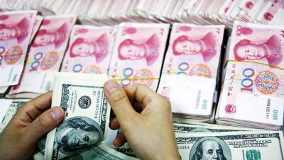 Центробанк Китая значительно повысил курс юаня к доллару
